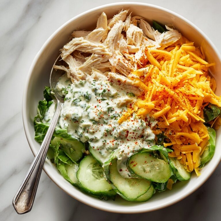 Cucumber Snack Bowl with Shredded Cheese, Diced Chicken, and Spiced Dressing Recipe